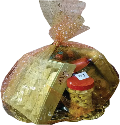 Kaju Katli (500g.), Namkeen (250g.), Saloni (250g.)
                    Kashmiri Mix (250g.), Aloo Chips 1pkt., Coconut Cookies 1box,
                    Cream Roll 3pcs., Kaju 100g., Badam 100g., Chocolate 1box,
                    Pepsi small